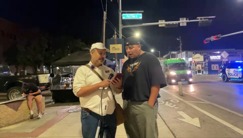 Gospel conversation on a city street at night